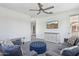 Bright upstairs bonus room, displaying neutral decor, media console, and access to a balcony at 22306 N 34Th Pl, Phoenix, AZ 85050