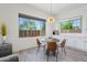 Light-filled dining area features a round table, chairs, and bright windows at 22306 N 34Th Pl, Phoenix, AZ 85050