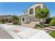 Beautiful two-story home with a brick driveway, manicured landscaping, and inviting curb appeal at 22306 N 34Th Pl, Phoenix, AZ 85050
