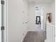 Hallway with neutral carpet leading to additional rooms, showcasing the home's open layout at 22306 N 34Th Pl, Phoenix, AZ 85050