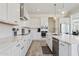 Bright kitchen with white cabinets, stainless appliances, and marble countertops at 22306 N 34Th Pl, Phoenix, AZ 85050