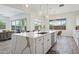 Open-concept kitchen with stainless steel appliances and a large island with seating at 22306 N 34Th Pl, Phoenix, AZ 85050
