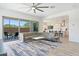 Open-concept living area with tile floors, large sectional sofa, and an easy flow to the kitchen at 22306 N 34Th Pl, Phoenix, AZ 85050