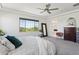 Main bedroom with neutral carpet and ample windows, adjoining bathroom, and walk in closet at 22306 N 34Th Pl, Phoenix, AZ 85050