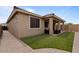 Beautiful backyard featuring an artificial lawn, patio, and walkway at 25030 N 172Nd Ln, Surprise, AZ 85387