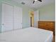 A simple bedroom with double door closet and traditional dresser at 25030 N 172Nd Ln, Surprise, AZ 85387
