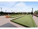 Bocce ball courts, lounge chairs, cafe lights, and well-maintained landscaping in this community at 25030 N 172Nd Ln, Surprise, AZ 85387