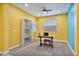 Well-lit office space features a desk, chair, and a mirrored storage cabinet at 25030 N 172Nd Ln, Surprise, AZ 85387