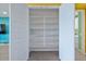 Walk-in pantry with multiple shelves for optimal storage and organization at 25030 N 172Nd Ln, Surprise, AZ 85387