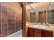 Bathroom featuring tile shower and a vanity with sink at 25232 N Horseshoe Trl, Scottsdale, AZ 85255