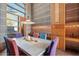Dining room with clerestory windows and colorful chairs providing a welcoming space for entertaining and dining at 25232 N Horseshoe Trl, Scottsdale, AZ 85255