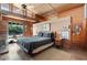Bright main bedroom features high ceilings, wood finishes, and patio access to the pool area at 25232 N Horseshoe Trl, Scottsdale, AZ 85255