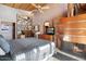 Spacious bedroom with fireplace, built-in bookshelves, and a cozy reading nook at 25232 N Horseshoe Trl, Scottsdale, AZ 85255