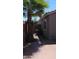 Backyard featuring a palm tree on a paved area next to the house at 25862 W North Star Pl, Buckeye, AZ 85326