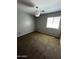 Bedroom featuring a window and neutral color scheme with neutral brown carpeting at 25862 W North Star Pl, Buckeye, AZ 85326