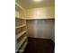 Walk-in closet with built-in shelving, offering ample storage space at 25862 W North Star Pl, Buckeye, AZ 85326