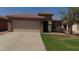 Charming single-story home with a well-maintained lawn and desert landscaping at 25862 W North Star Pl, Buckeye, AZ 85326
