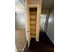Hallway linen closet with multiple shelves for additional storage space at 25862 W North Star Pl, Buckeye, AZ 85326