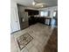 The kitchen features stainless appliances, dark cabinetry and an eat-in area at 25862 W North Star Pl, Buckeye, AZ 85326