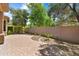 View of brick paver patio, block fence and desert landscaping at 27581 N 129Th Ln, Peoria, AZ 85383
