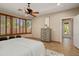 A lovely bedroom with a ceiling fan, a bay window with shutters, and neutral-toned walls at 27581 N 129Th Ln, Peoria, AZ 85383