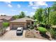 A well-maintained home featuring a desert landscape, a 3-car garage, and a charming courtyard entrance at 27581 N 129Th Ln, Peoria, AZ 85383