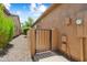 View of side yard, rock landscaping and private gate at 27581 N 129Th Ln, Peoria, AZ 85383