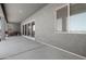 Covered back porch with stucco walls and a concrete floor looking out to a large dirt lot at 30639 N Dorado Ct, Queen Creek, AZ 85144