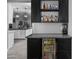 Stylish bar area features a beverage cooler, shelves stocked with liquor, and a countertop for preparing drinks at 30639 N Dorado Ct, Queen Creek, AZ 85144