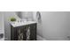 Stylish powder room featuring a modern vanity with a vessel sink and decorative mirror at 30639 N Dorado Ct, Queen Creek, AZ 85144