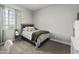 Cozy bedroom featuring neutral decor, carpet floors, and natural light at 30639 N Dorado Ct, Queen Creek, AZ 85144