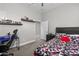 Bedroom with sports decor, a ceiling fan, carpet, and gaming desk at 30639 N Dorado Ct, Queen Creek, AZ 85144