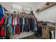 Walk-in closet featuring multiple shelves and rods for optimal clothing and accessory storage at 30639 N Dorado Ct, Queen Creek, AZ 85144