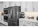 Close up of modern kitchen featuring stainless steel appliances, custom cabinets, and stylish countertops at 30639 N Dorado Ct, Queen Creek, AZ 85144