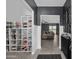 Open-concept entry with decorative shelving and view to a cozy living room bathed in natural light at 30639 N Dorado Ct, Queen Creek, AZ 85144