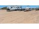 Large dirt lot with a trailer and a boat at 30639 N Dorado Ct, Queen Creek, AZ 85144