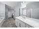 Elegant main bathroom with dual sinks, quartz countertops, and a relaxing soaking tub at 30639 N Dorado Ct, Queen Creek, AZ 85144