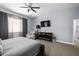 Serene main bedroom boasting neutral tones, plush carpeting, and a cozy reading nook at 30639 N Dorado Ct, Queen Creek, AZ 85144