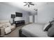 Neutral bedroom with carpet, a ceiling fan, and a reading chair at 30639 N Dorado Ct, Queen Creek, AZ 85144