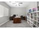 Spacious office featuring multiple workstations, ample storage, and wood-look tile flooring at 30639 N Dorado Ct, Queen Creek, AZ 85144