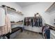 Well-organized walk-in closet with ample hanging space, shelving, and carpet floors at 30639 N Dorado Ct, Queen Creek, AZ 85144