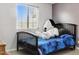 A fun bedroom featuring a comfortable bed and bright, natural light at 3107 N 79Th Ave, Phoenix, AZ 85033