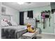 Cozy bedroom featuring a plush bed, soft lighting, and tranquil atmosphere at 3107 N 79Th Ave, Phoenix, AZ 85033