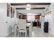 Bright eat-in kitchen featuring tile floors, wood beams, and stainless steel appliances at 3107 N 79Th Ave, Phoenix, AZ 85033