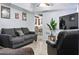 Cozy living room with comfortable seating, tiled floor, and a bright, airy atmosphere at 3107 N 79Th Ave, Phoenix, AZ 85033