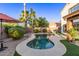 Charming backyard showcasing a freeform pool, landscaped garden, and tranquil outdoor atmosphere at 3466 E Bruce Ave, Gilbert, AZ 85234