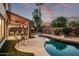 Picturesque backyard showcasing a freeform pool, outdoor kitchen, and comfortable seating arrangements at 3466 E Bruce Ave, Gilbert, AZ 85234