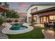 Backyard with a pool, covered patio, and outdoor seating area provides an ideal space for relaxation at 3466 E Bruce Ave, Gilbert, AZ 85234