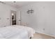 Bright bedroom with neutral walls, carpet floors, and a view to the ensuite bath at 3466 E Bruce Ave, Gilbert, AZ 85234