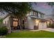 Well-maintained two-story home with a lush green lawn, a two-car garage, and inviting front entrance at 3466 E Bruce Ave, Gilbert, AZ 85234